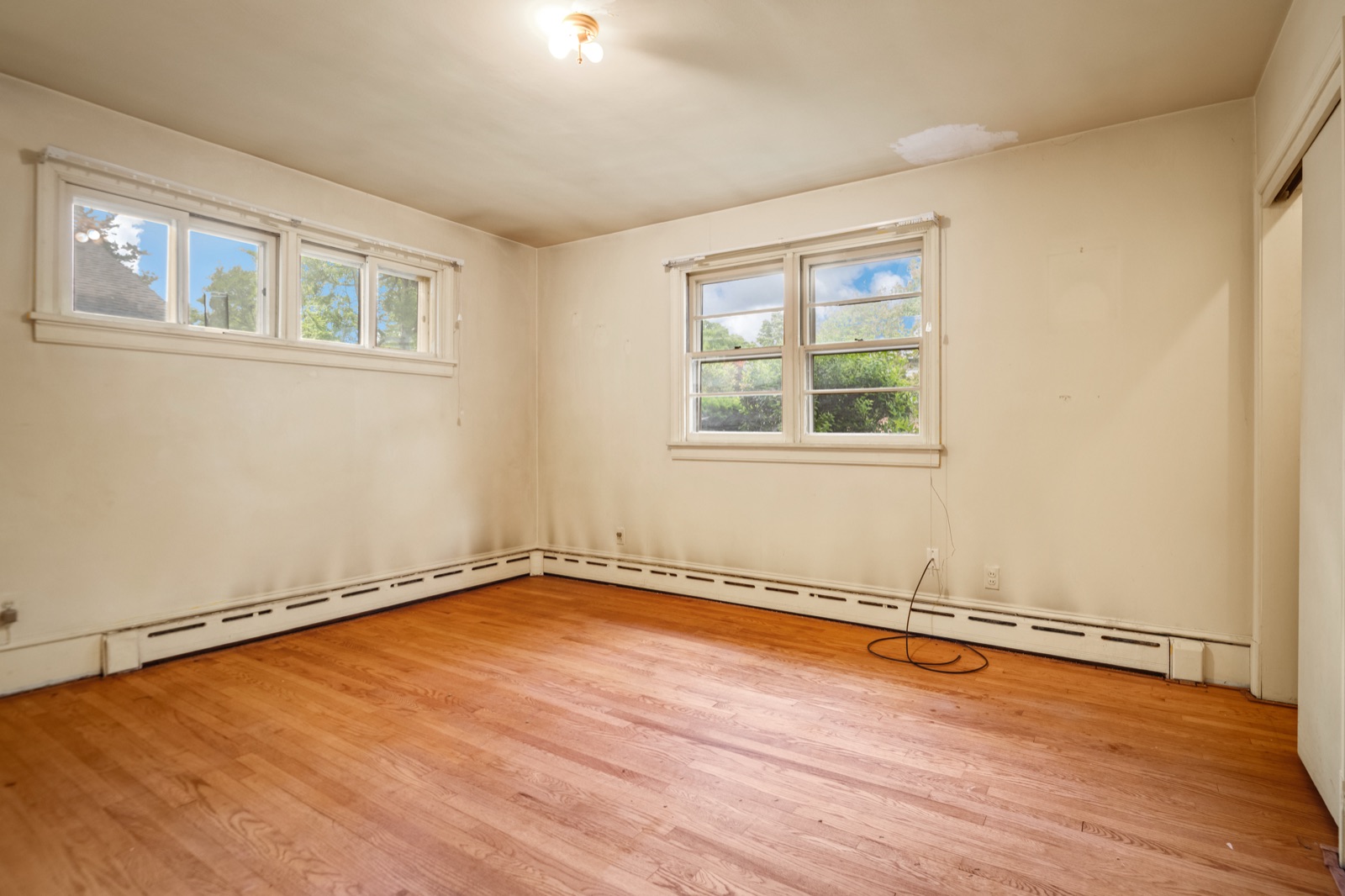 The primary bedroom at 1407 Wentbridge Road, with hardwood floors and natural light