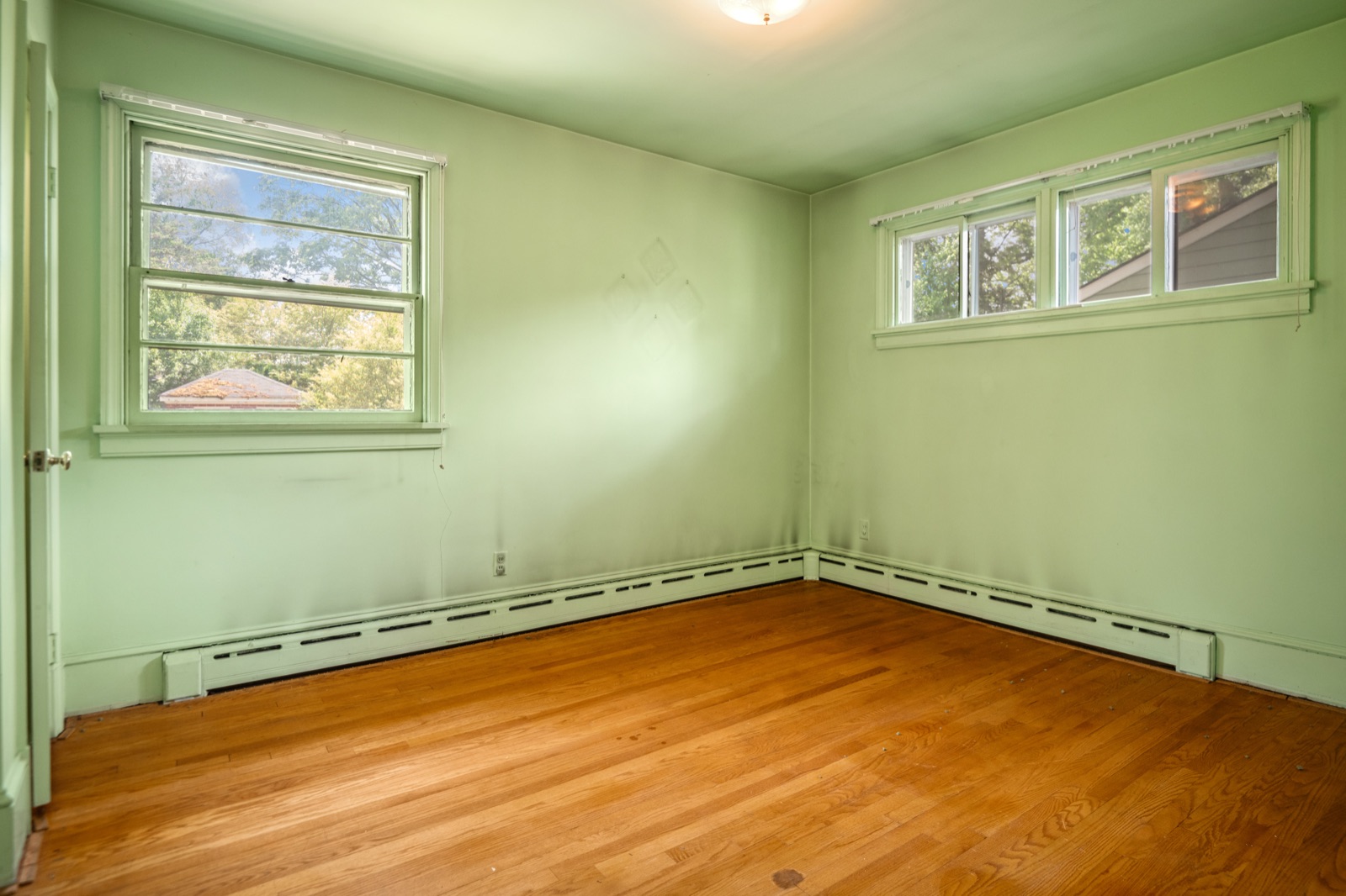 The second main-level bedroom at 1407 Wentbridge Road, with hardwood floors